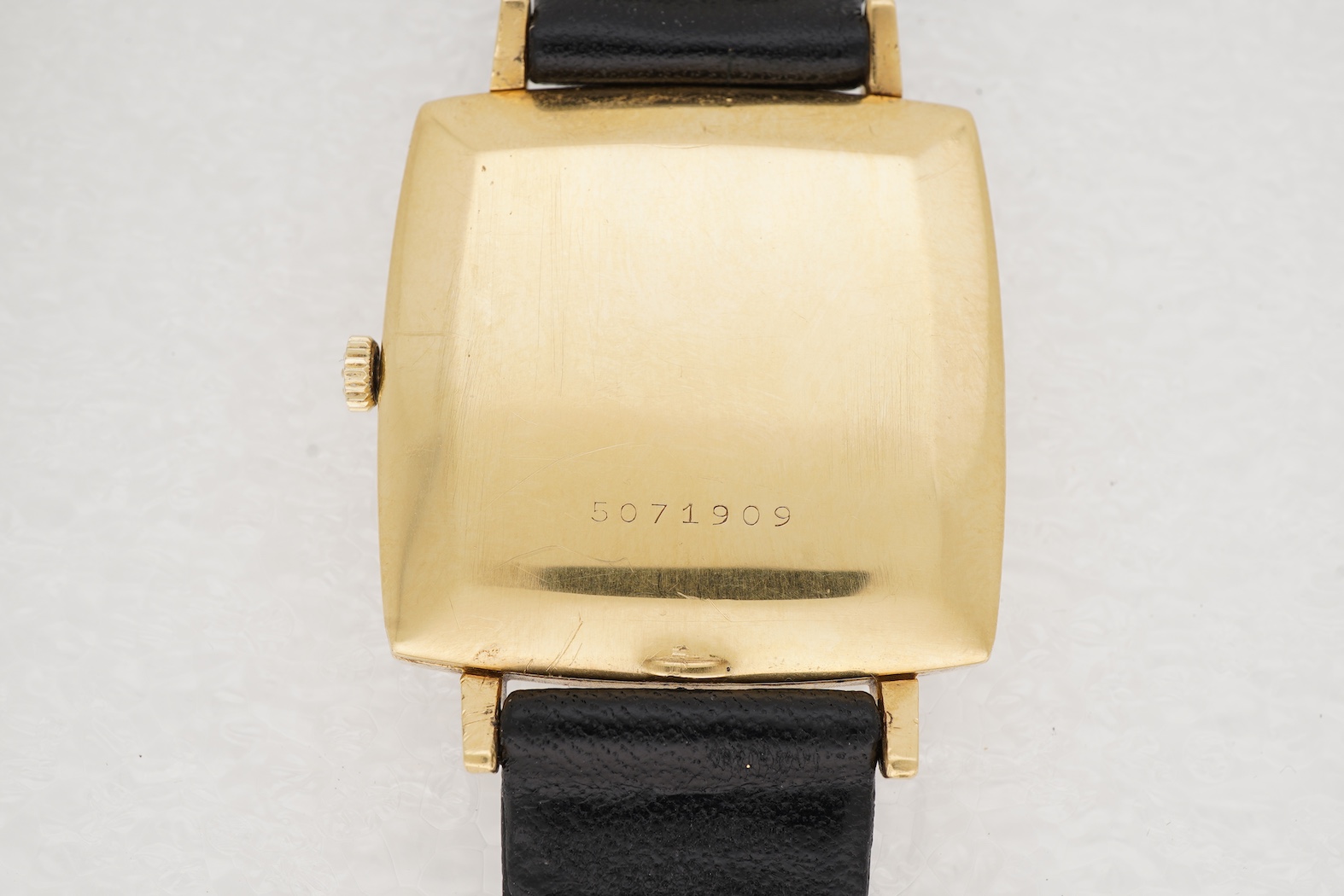 A gentleman's 18ct gold Eterna-Matic 3000 wrist watch, with baton hour marker, centre seconds hand and calendar aperture at 3 o’clock, on an associated black leather strap